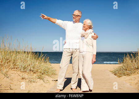 happy senior couple on summer beach Stock Photo