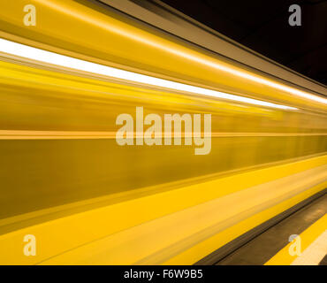 Yellow metro train in motion .Transportation in Naples city, Italy. Stock Photo