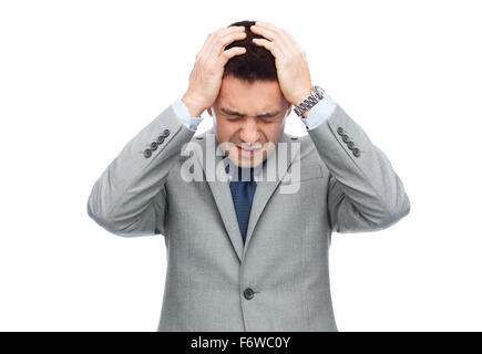 businessman in suit having head ache Stock Photo