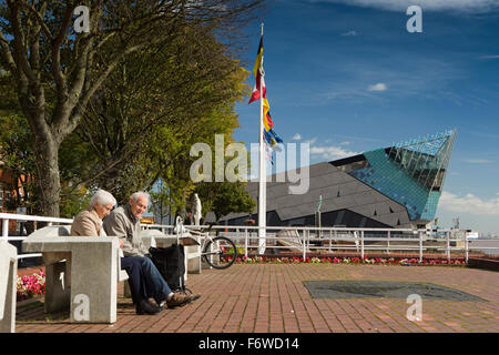 UK, England, Yorkshire, Hull, Nelson Street, Victoria Pier pensioners relaxing in sun on bench Stock Photo