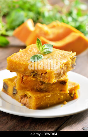 Pumpkin bars with nuts on wooden table Stock Photo