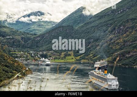 Giant Cruise Liners, MS Queen Elizabeth II, Costa Fortuna & Serenade of the Seas, Moored in Geiranger Fjord, Norway. Stock Photo