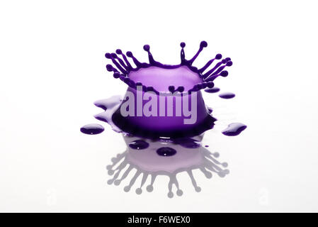 purple paint splash isolated on white background Stock Photo - Alamy