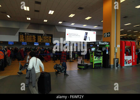 TrueStar luggage wrapping machine in check in area at Jorge Chávez International Airport, Callao, Lima, Peru Stock Photo