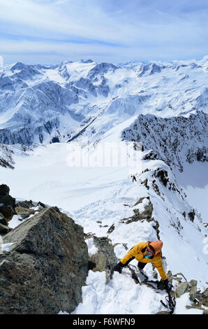 Woman climbing to Ruderhofspitze, Stubai Alps, Tyrol, Austria Stock Photo