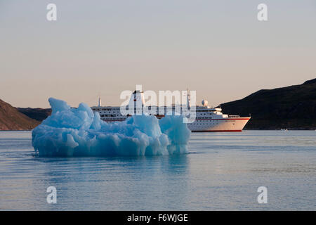 Iceberg and cruise ship MS Deutschland  Reederei Peter Deilmann , Narssaq, Kitaa, Greenland Stock Photo