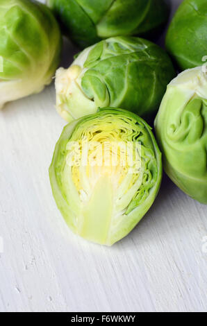 Fresh brussel sprouts on white wooden background Stock Photo