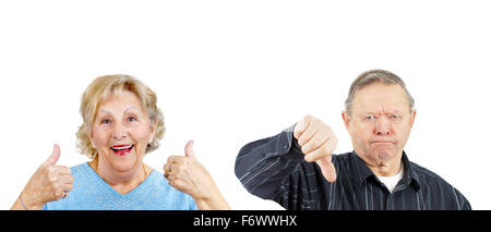 Senior woman giving two thumbs up and grumpy man thumb down Stock Photo