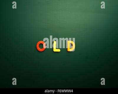 old concept in colorful letters isolated on blank blackboard Stock Photo