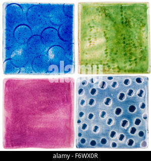 Handmade glazed ceramic tiles isolated on white background Stock Photo