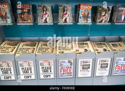 Complementary newspapers and magazines, Gatwick airport north terminal, London, England, UK Stock Photo