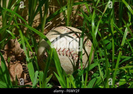 Baseball in the grass Stock Photo