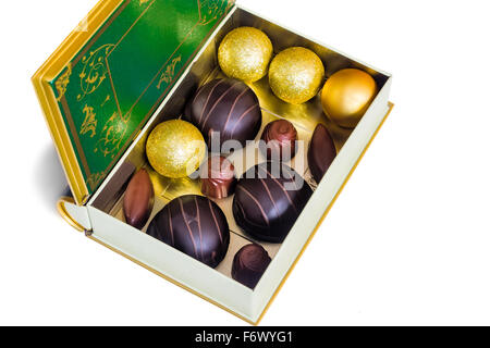 A variety of chocolates in a box. Presented on a white background. Stock Photo