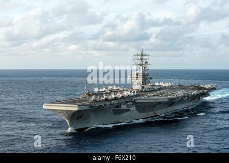 US Navy Nimitz-class aircraft carrier USS Ronald Reagan transits the Philippine Sea November 15, 2015 off the Philippine Islands. Stock Photo