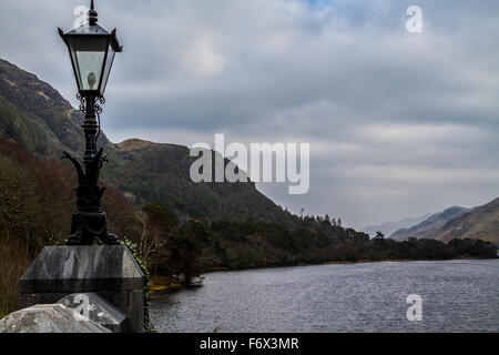 Misty view of Lake Pollacapall from Kylemore Abbey, Connemara, County Galway, Ireland Stock Photo