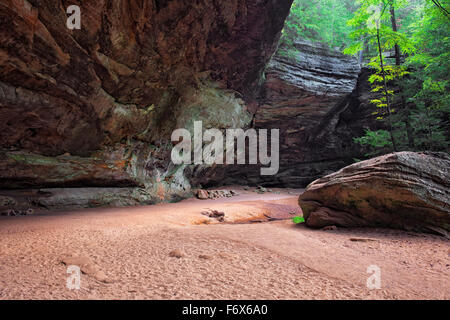 The largest cave in Ohio is Ash Cave with its large overhanging ledge in Hocking Hills State Park. Stock Photo