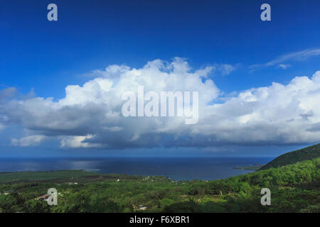 Cumulus clouds over historic Kealakeku Bay, site of Captain Cook’s death and monument; Kona, Island of Hawaii, Hawaii, USA Stock Photo