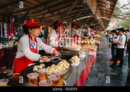 Beijing, China - The view of Donghuamen snack street in the daytime. They are selling many delicious traditional Beijing snacks. Stock Photo