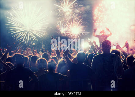 Crowd watching fireworks and celebrating New Year Stock Photo