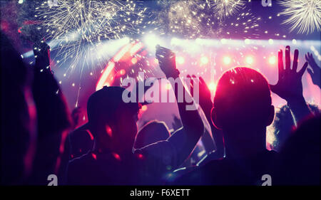 Crowd watching fireworks and celebrating New Year Stock Photo