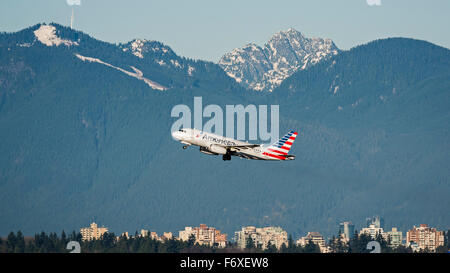 American Airlines Airbus A319 (N830AW) takes off from Vancouver International Airport scenic Vancouver background Stock Photo