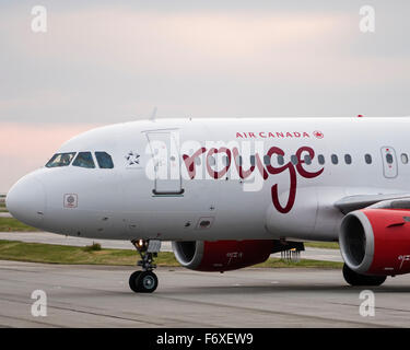 Air Canada rouge Airbus A319 C-GBHY logo livery on front of aircraft fuselage Stock Photo