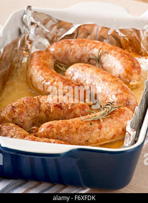 Homemade sausages baked in the oven Stock Photo