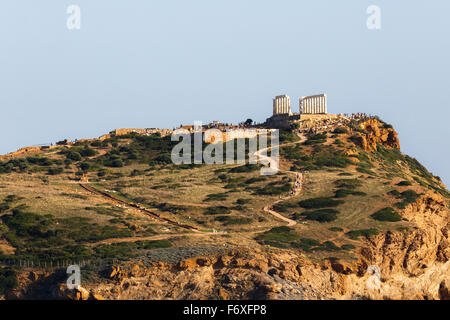 The Temple of Poseidon at Sounio, Greece against a cloudy sky, shot taken from across the bay Stock Photo