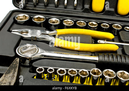 Set of various chrome yellow tools in box isolated on white Stock Photo