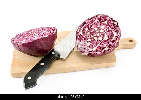 Red cabbage with knife and cutting board isolated on white Stock Photo