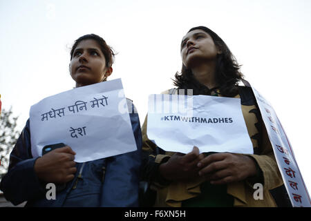 Kathmandu, Nepal. 21st Nov, 2015. Nepalese women hold placards as they participate in a candle light vigil lighting 100 candles to observe a minute of silence marking 100 days of Madhes protest of Nepal-India border blockade and the deaths following in those days in Maitighar Mandala, Kathmandu, Nepal on Saturday, November 21, 2015. People of Kathmandu, who stand in solidarity with the people of Madhes have been using the popular hashtag #KTMwithMadhes. Photo/Skanda Gautam Credit:  Skanda Gautam/ZUMA Wire/Alamy Live News Stock Photo