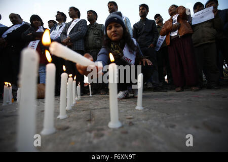 Kathmandu, Nepal. 21st Nov, 2015. A Nepalese woman light candles as people participate in a vigil lighting 100 candles to observe a minute of silence marking 100 days of Madhes protest of Nepal-India border blockade and the deaths following in those days in Maitighar Mandala, Kathmandu, Nepal on Saturday, November 21, 2015. People of Kathmandu, who stand in solidarity with the people of Madhes have been using the popular hashtag #KTMwithMadhes. Photo/Skanda Gautam Credit:  Skanda Gautam/ZUMA Wire/Alamy Live News Stock Photo