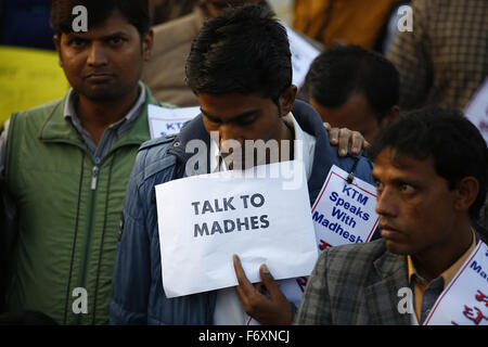 Kathmandu, Nepal. 21st Nov, 2015. Nepalese activists hold placards as they participate in a candle light vigil by lighting 100 candles to observe a minute of silence marking 100 days of Madhes protest of Nepal-India border blockade and the deaths following in those days in Maitighar Mandala, Kathmandu, Nepal on Saturday, November 21, 2015. People of Kathmandu, who stand in solidarity with the people of Madhes have been using the popular hashtag #KTMwithMadhes. Photo/Skanda Gautam Credit:  Skanda Gautam/ZUMA Wire/Alamy Live News Stock Photo