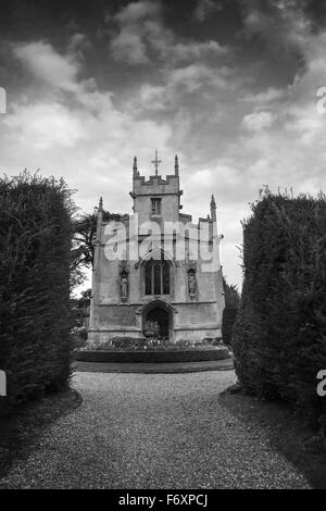 Ancient rural church in grounds, England Stock Photo