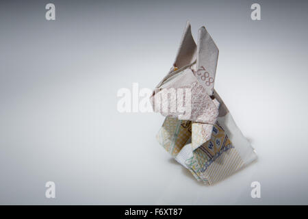 Still life image of a origami rabbit make from English money Stock Photo