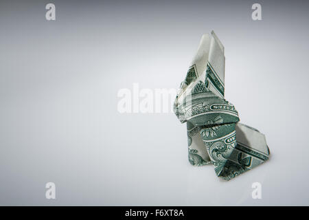 Still life image of a origami rabbit make from one dollar note Stock Photo