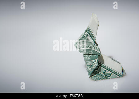 Still life image of a origami rabbit make from one dollar note Stock Photo