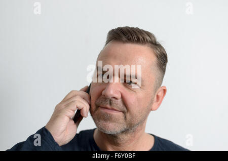 Attractive middle age man with cell phone Stock Photo
