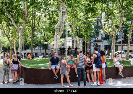 Madrid Spain,Europe,Spanish,Hispanic Latin Latino ethnic immigrant immigrants minority,Centro,Chueca,Calle Hortaleza,Plaza Santa Barbara,park,adult ad Stock Photo