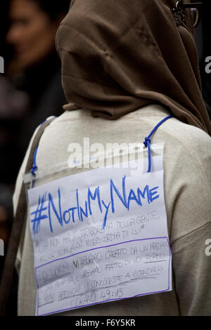Rome, Italy. 21st Nov, 2015. A banner hanging on a woman's back reading 'Not in My Name' is seen during a demonstration in Rome, Italy, on Nov. 21, 2015. A demonstration launched by Islamic communities with the theme 'Not in My Name' is held here on Saturday to protest against the Paris terror attacks. Credit:  Jin Yu/Xinhua/Alamy Live News
