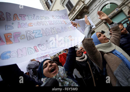 Rome, Italy. 21st Nov, 2015. Women shout slogans with a banner reading 'Let's break down the walls of misunderstanding, let's strengthen the bridges of sharing' during a demonstration in Rome, Italy, on Nov. 21, 2015. A demonstration launched by Islamic communities with the theme 'Not in My Name' is held here on Saturday to protest against the Paris terror attacks. Credit:  Jin Yu/Xinhua/Alamy Live News