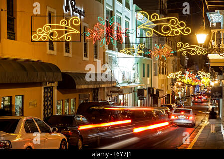 Street decorated for Christmas and streaking car lights, Old San Juan, Puerto Rico Stock Photo