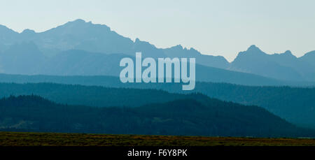 Sawtooth Mountains in haze from nearby forest fires. Stock Photo