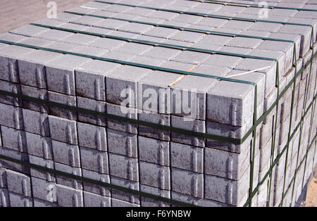 Stack of cement bricks tied with plastic Stock Photo