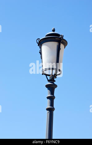 Vintage street lamp on blue sky background Stock Photo