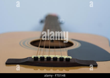 View from below the bridge of an acoustic guitar Stock Photo