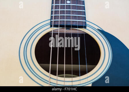 A close up of an acoustic guitar sound hole Stock Photo