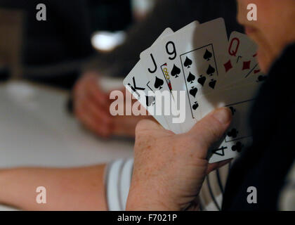 playing cards in hand Stock Photo