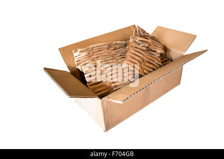 Open empty cardboard shipping box with eco-friendly packing material on isolated white background Stock Photo