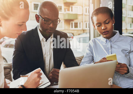 Business partners working, multi ethnic group of people, small office Stock Photo